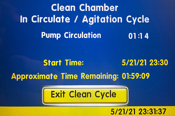 The screen for the Clean Cycle is blue with yellow, black, and white wording explaining the length of the cleaning cycle.